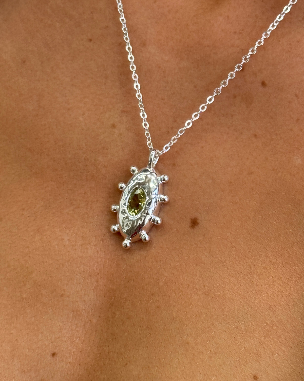 Coral sterling silver necklace worn on the neck
