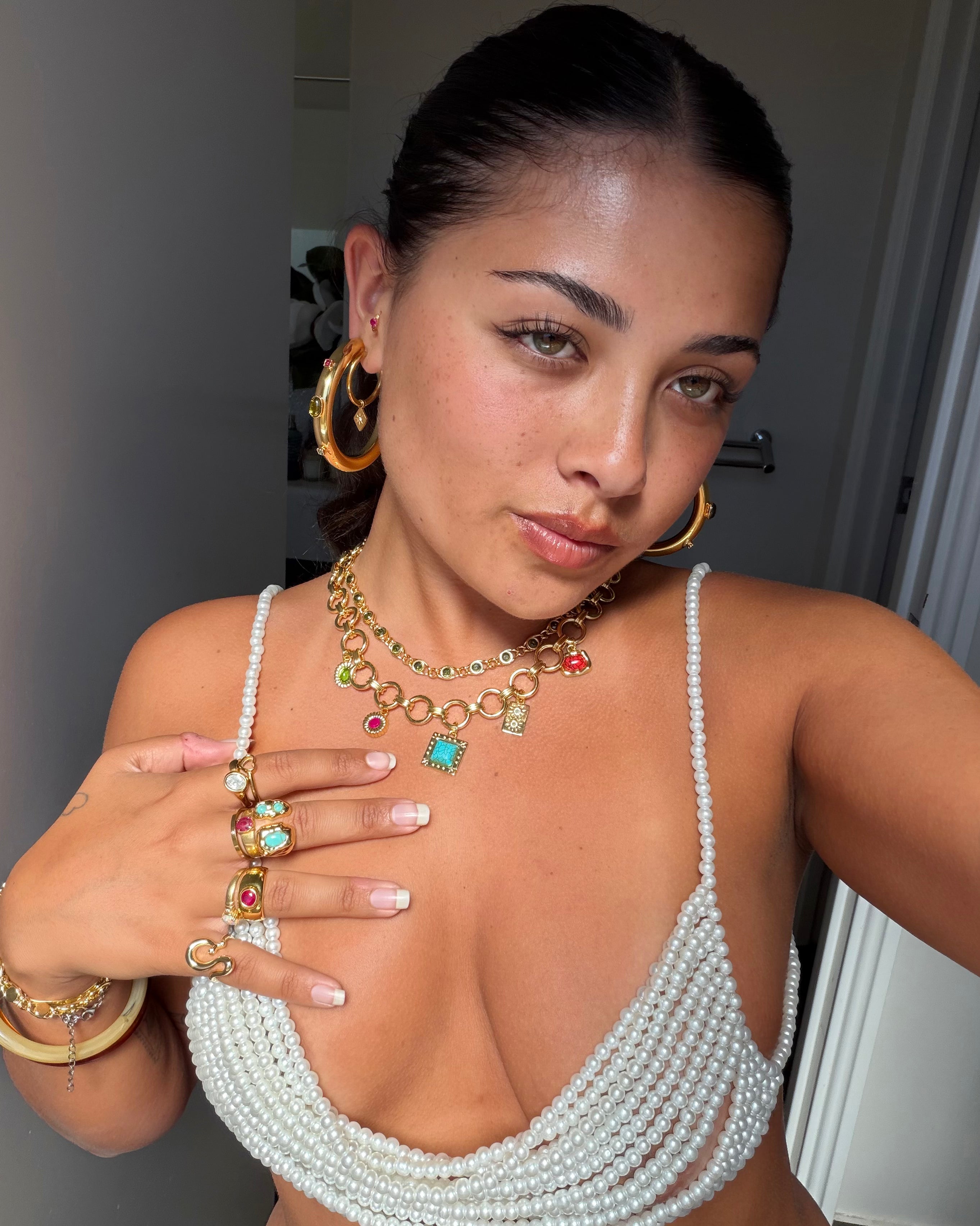 Bulobo Gold Earrings, Paloma Gold Necklace, Galia Gold Ring and more Cami Citrine pieces worn together by a model