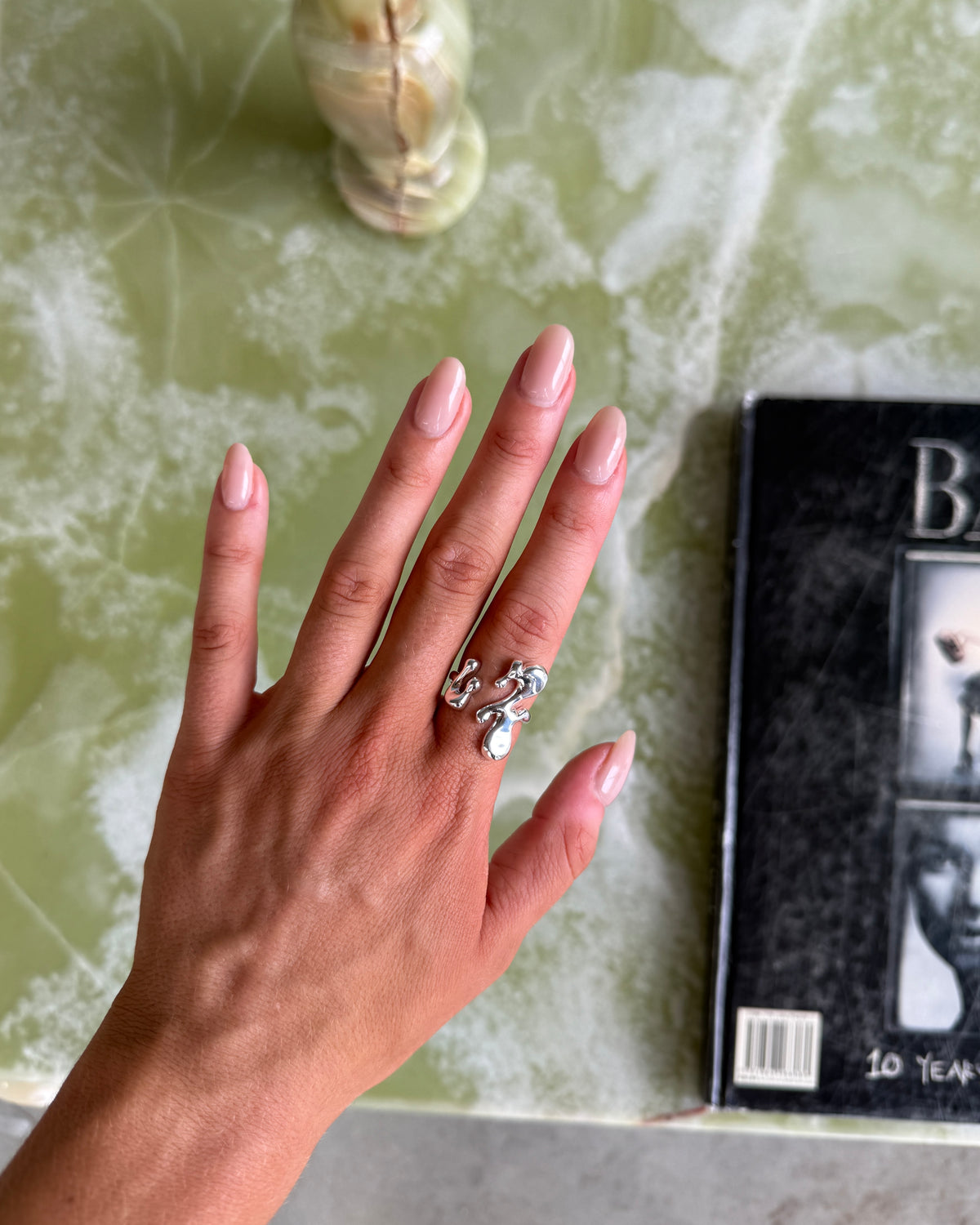 Close-up of Vespera sterling silver ring on the finger