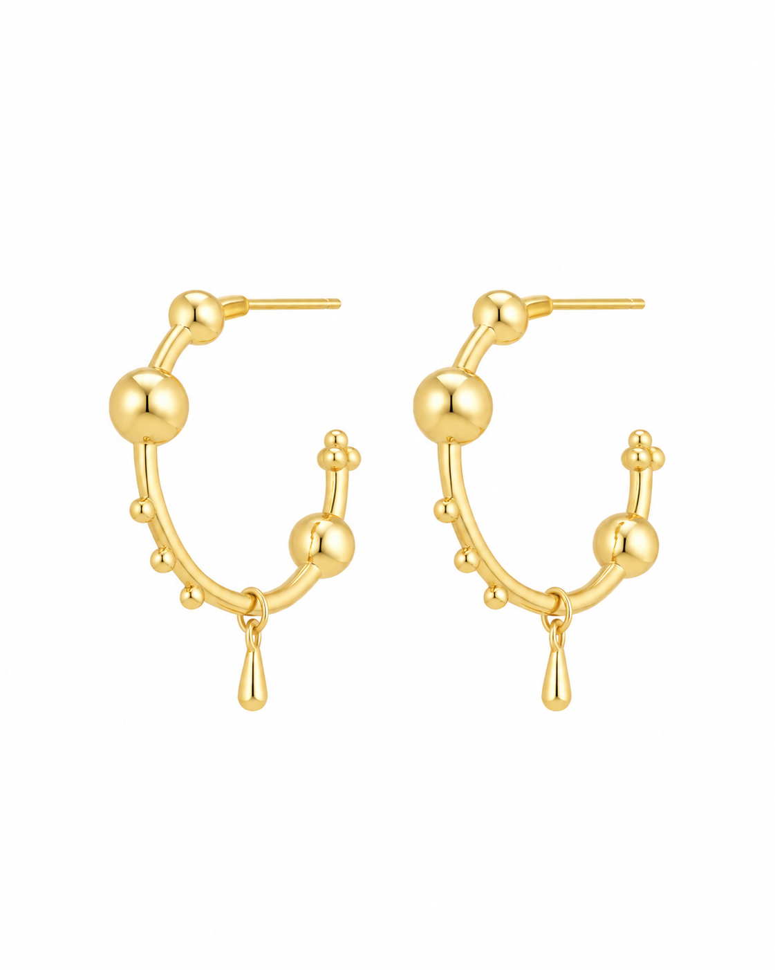 Orbit gold-plated sculptural hoop earrings on a white background